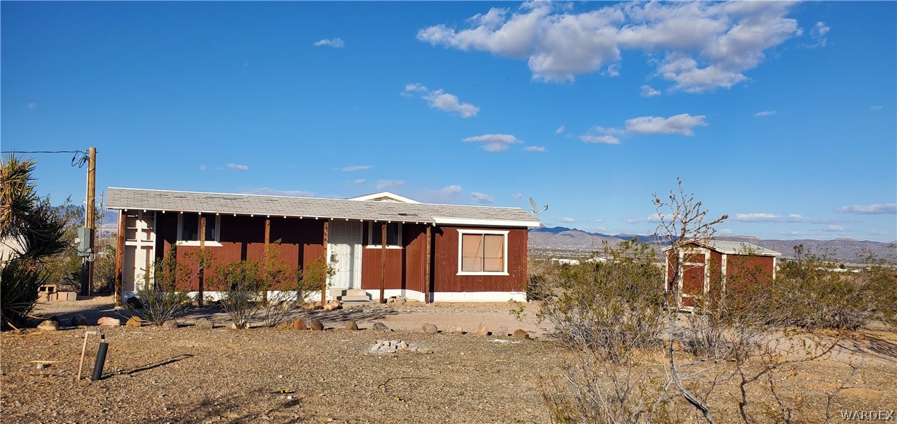 1534 Elgin Road Golden Valley, AZ 86413 - Photo 3 of 58 a front view of a house with a yard