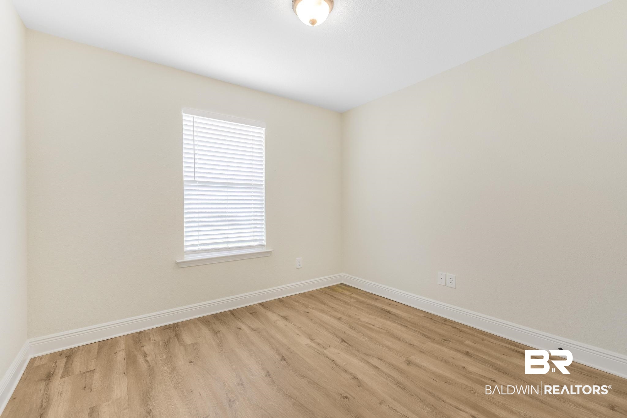 21580 Talbot Lane Robertsdale, AL 36567 - Photo 9 of 25 Unfurnished room with baseboards and light wood-style flooring