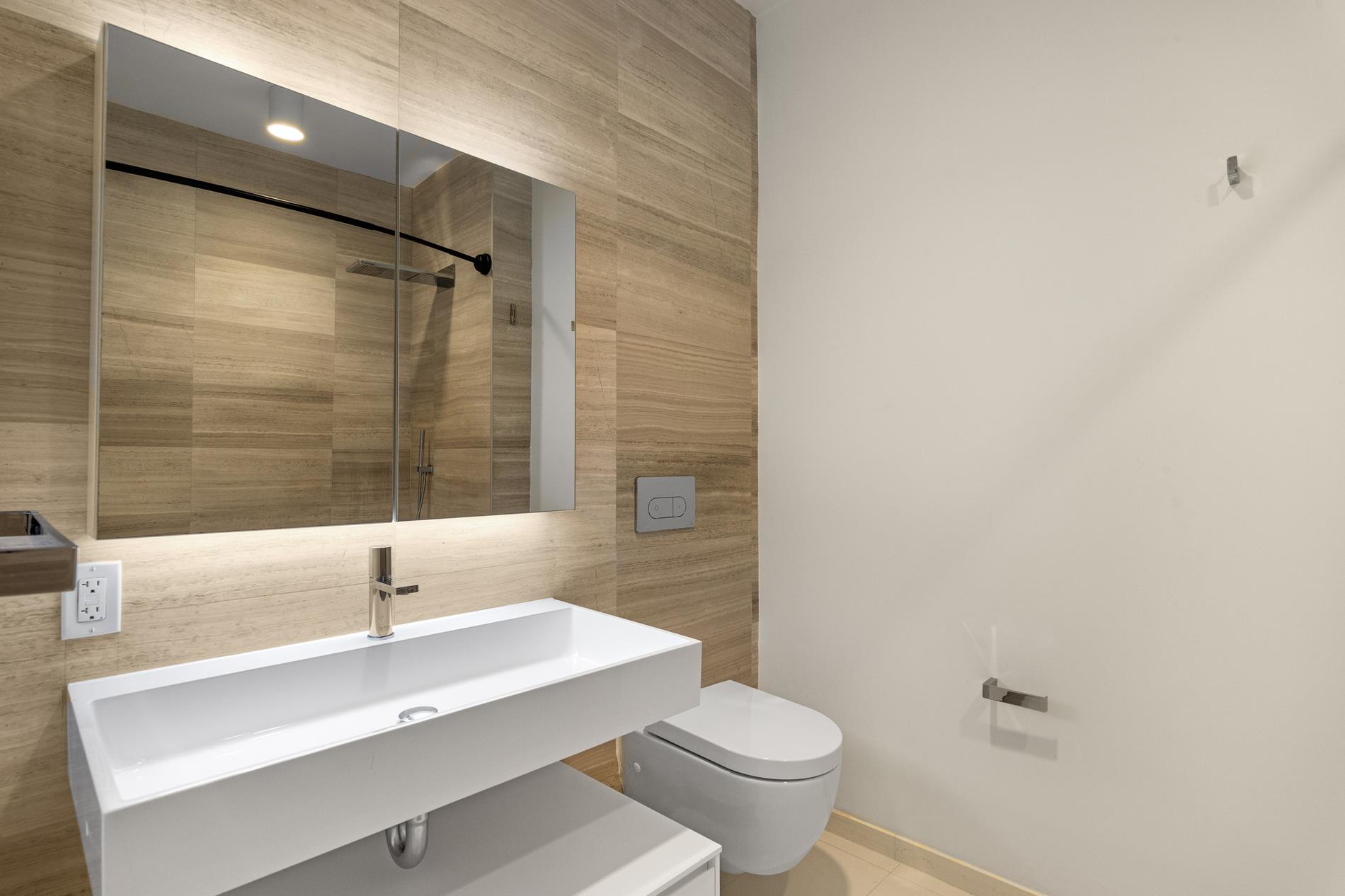 160 Imlay Street, Unit 3B2 Brooklyn, NY 11231 - Photo 10 of 18 a bathroom with a sink a toilet and shower