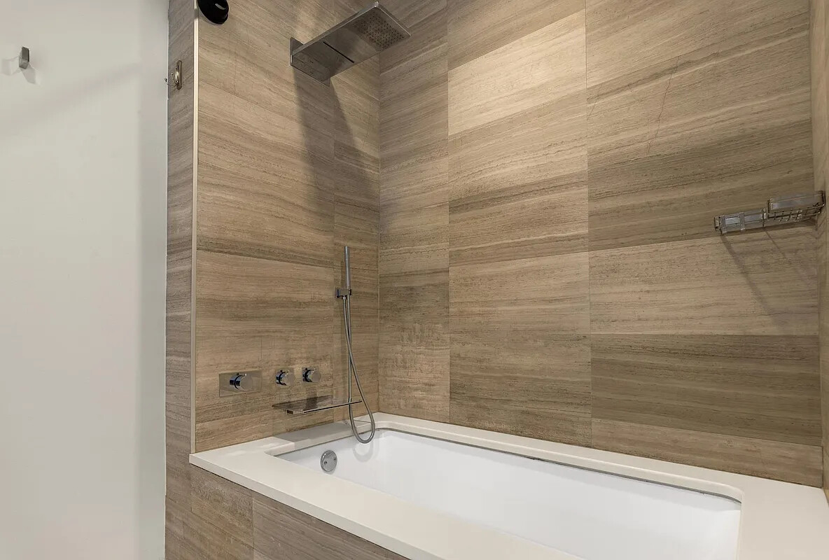 160 Imlay Street, Unit 3B2 Brooklyn, NY 11231 - Photo 13 of 18 a bathroom with a bathtub and shower