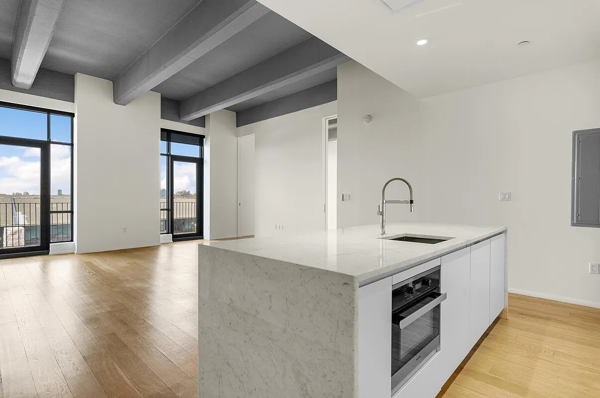 160 Imlay Street, Unit 3B2 Brooklyn, NY 11231 - Photo 4 of 18 a view of a sink and dishwasher with wooden floor