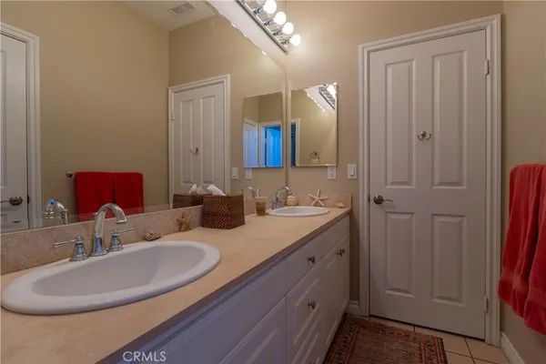 a bathroom with a toilet and a mirror
