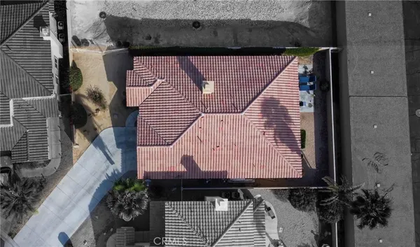 a view of a backyard with swimming pool