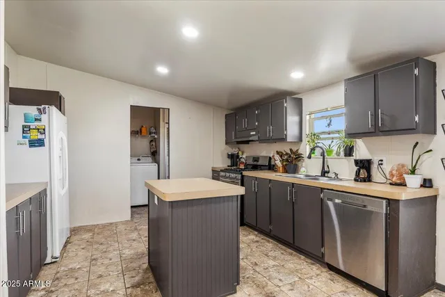 a kitchen with kitchen island granite countertop lots of counter top space