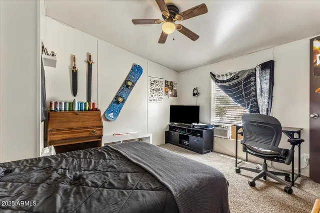 a bedroom with furniture and a chandelier