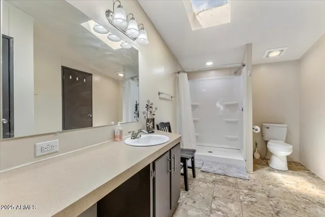 a bathroom with a sink a toilet and a bathtub