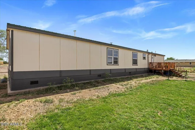 a house view with a backyard space