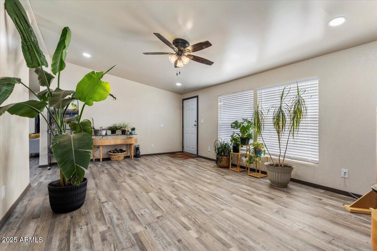 936 Paper Mill Road Taylor, AZ 85939 - Photo 4 of 43 a living room with furniture potted plant and a window