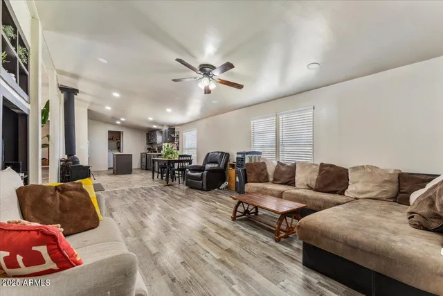 a living room with furniture potted plant and a window