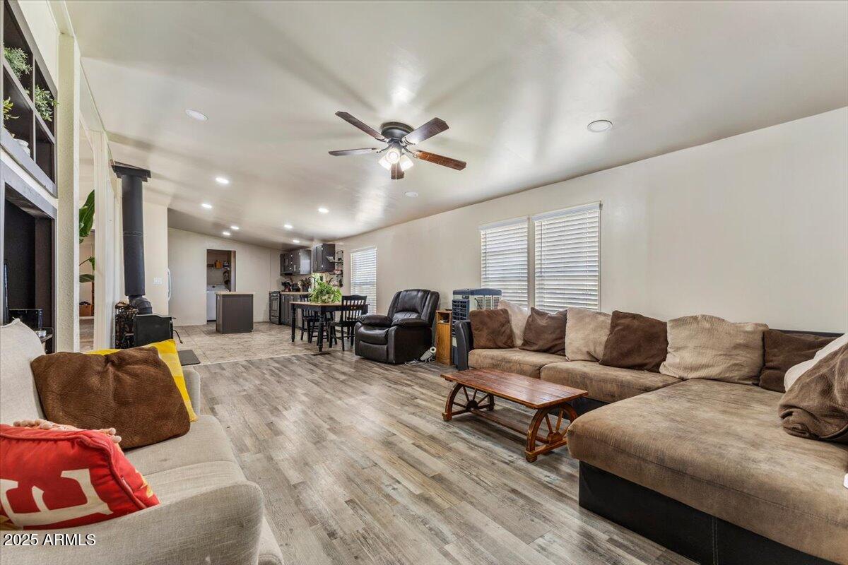 936 Paper Mill Road Taylor, AZ 85939 - Photo 5 of 43 a living room with furniture kitchen view and a chandelier