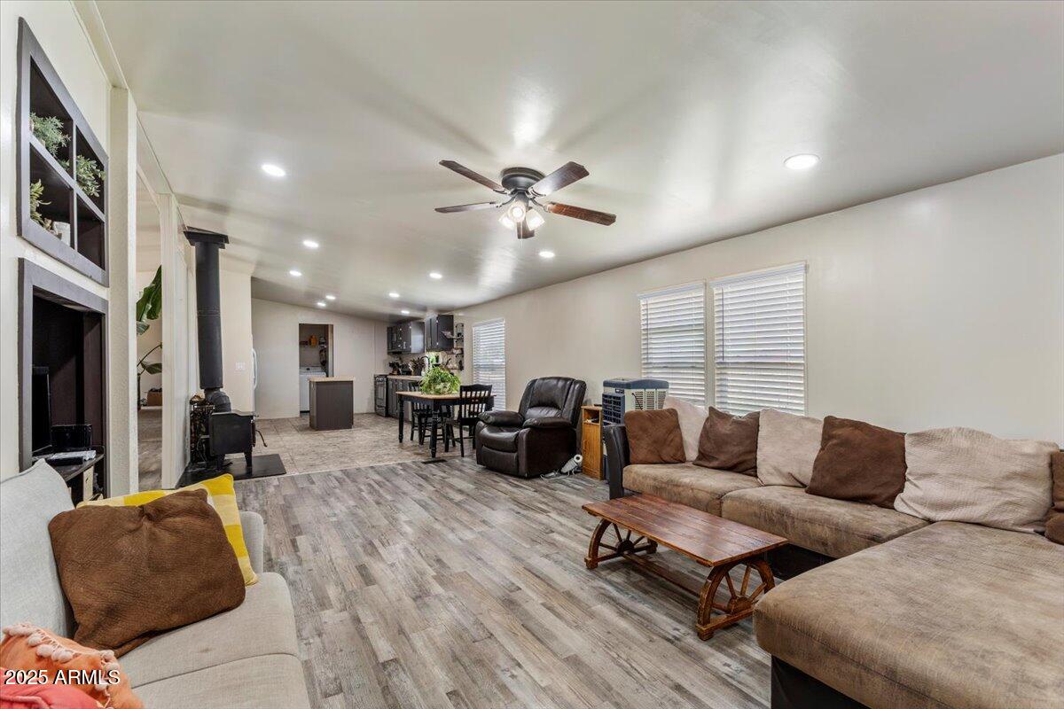 936 Paper Mill Road Taylor, AZ 85939 - Photo 7 of 43 a living room with furniture ceiling fan and a rug