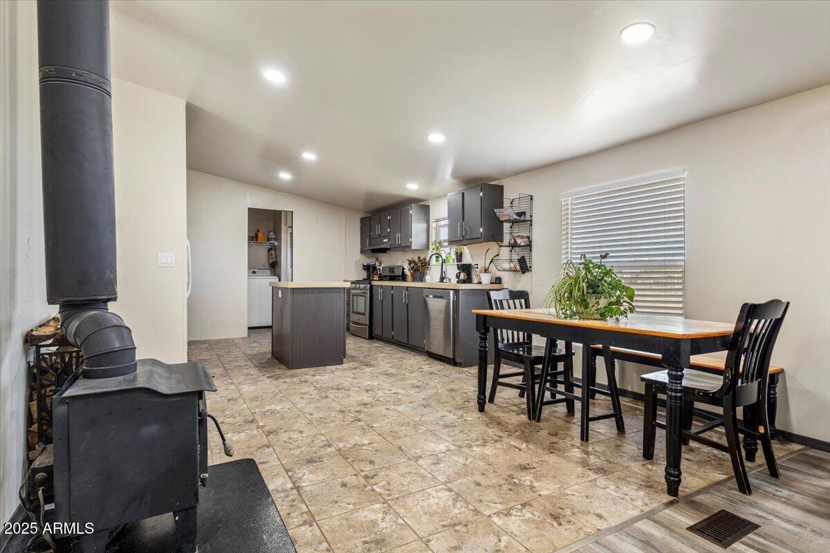 936 Paper Mill Road Taylor, AZ 85939 - Photo 8 of 43 a kitchen with a table and chairs in it