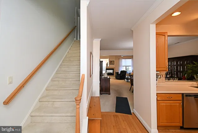 a view of a living room with furniture and a fireplace