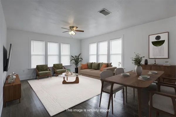 a view of a dining room with furniture window and outside view