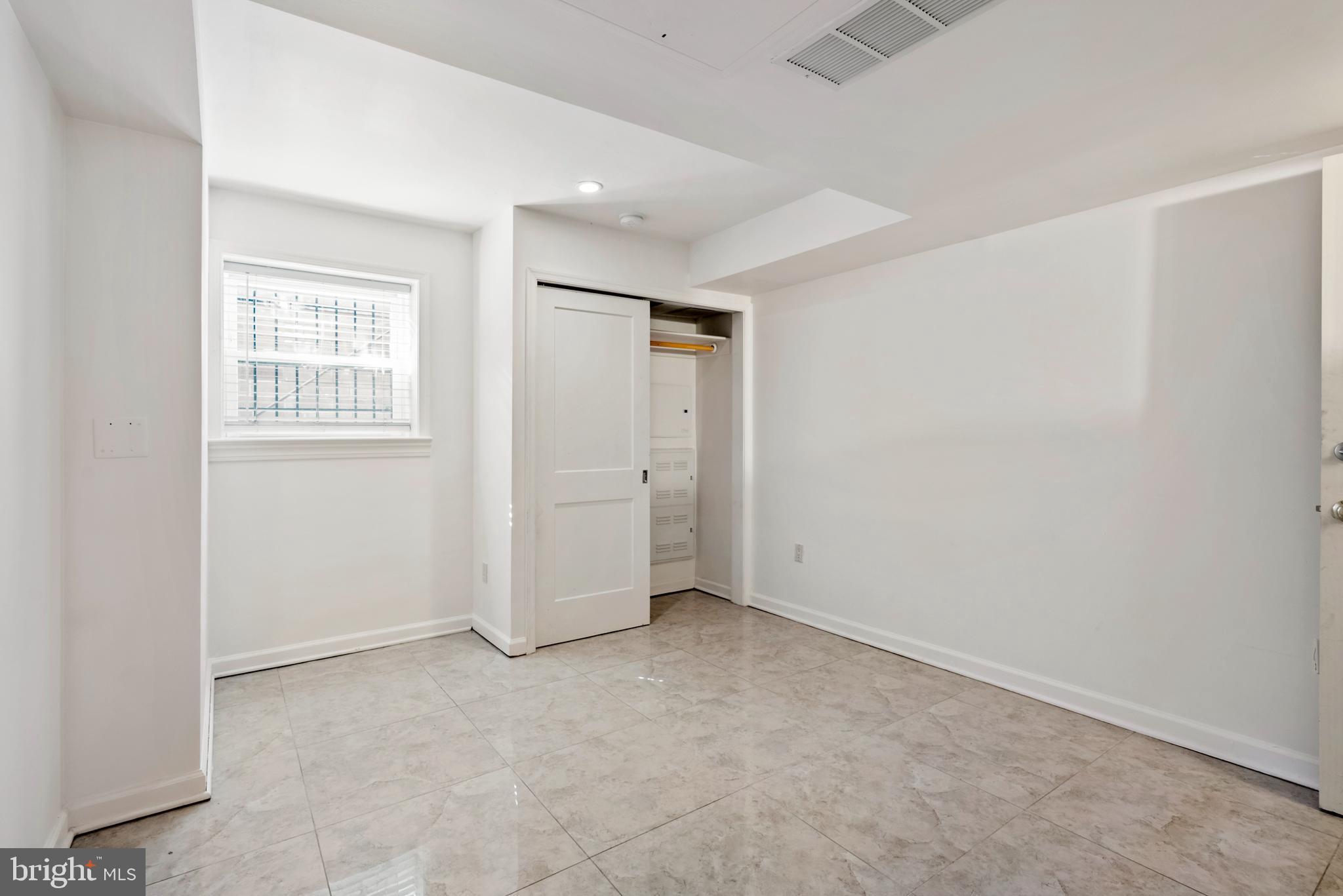 966 Mt Olivet Road Northeast Washington, DC 20002 - Photo 12 of 21 an empty room with windows