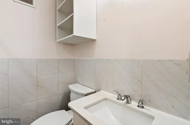 a view of a cars park in front of a building