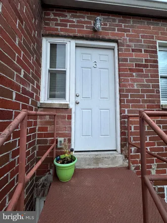a view of a house with brick walls