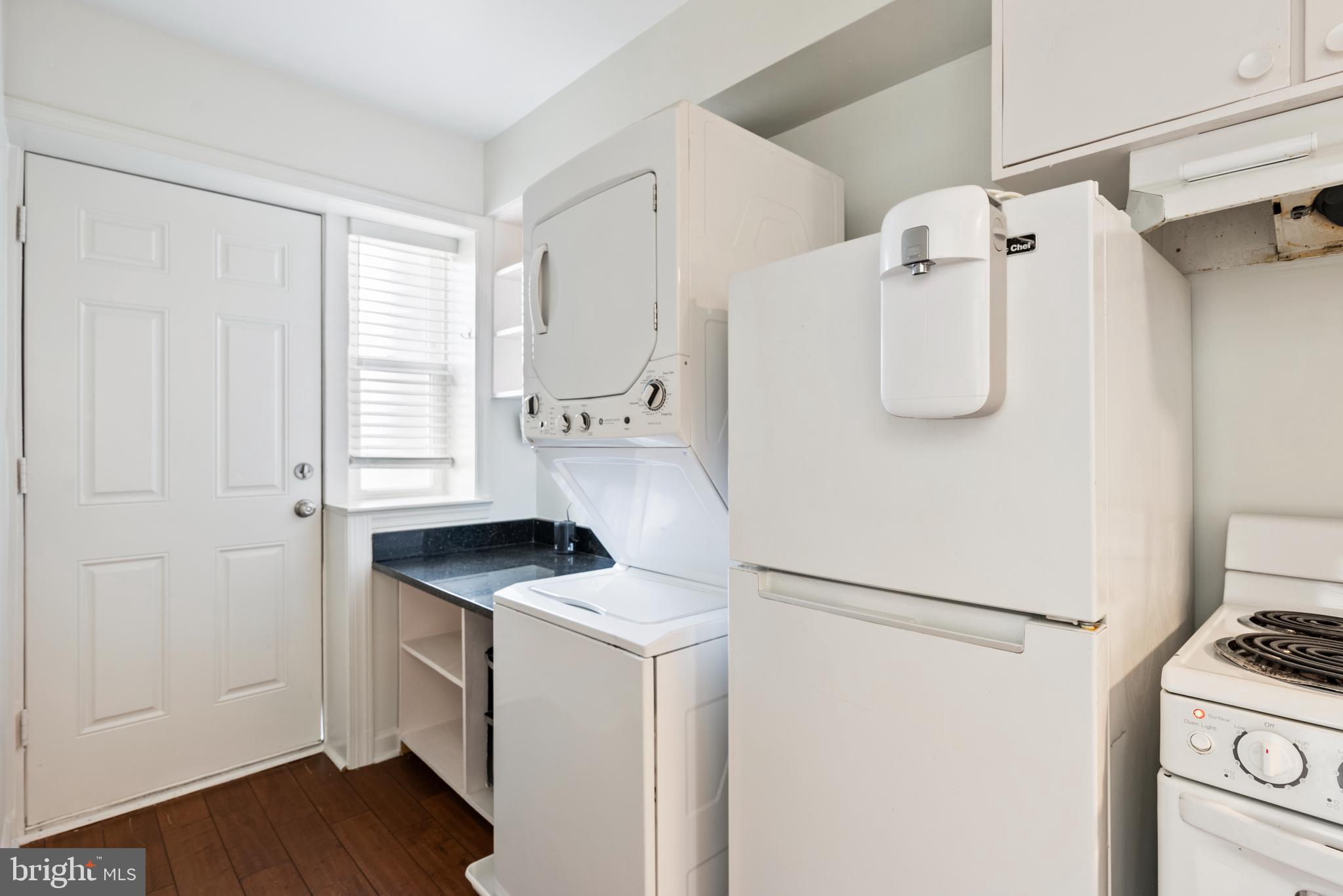 966 Mt Olivet Road Northeast Washington, DC 20002 - Photo 2 of 21 a white refrigerator freezer and a wooden floor