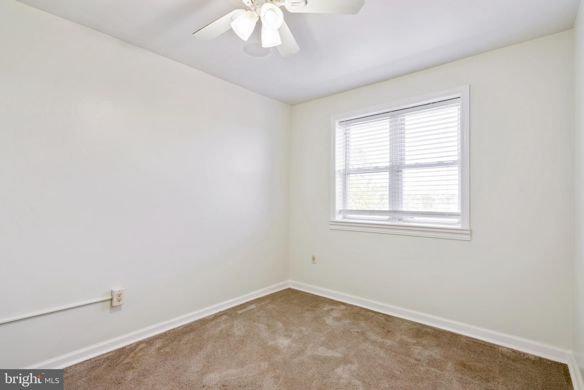 966 Mt Olivet Road Northeast Washington, DC 20002 - Photo 6 of 21 an empty room with a window