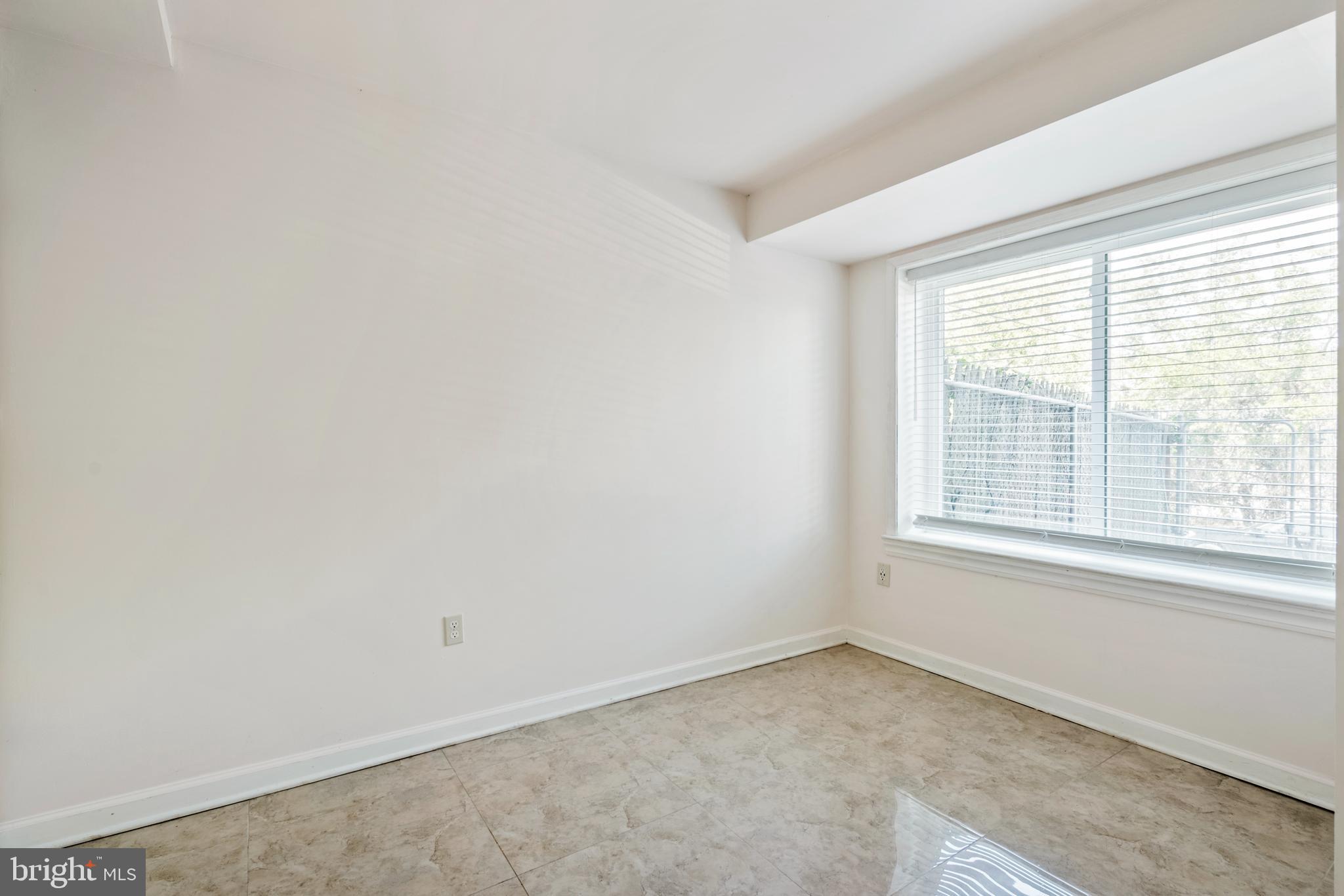 966 Mt Olivet Road Northeast Washington, DC 20002 - Photo 10 of 21 an empty room with a window