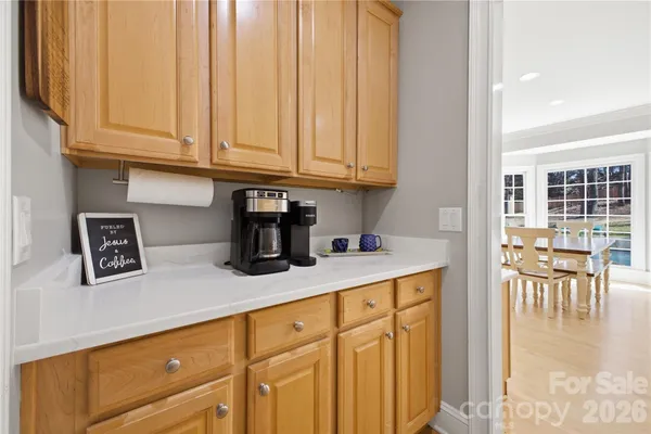 a kitchen with stainless steel appliances granite countertop a sink dishwasher and cabinets with wooden floor