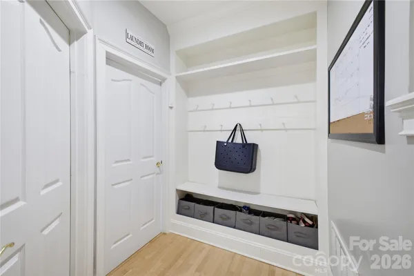 a living room with a bed and a flat screen tv