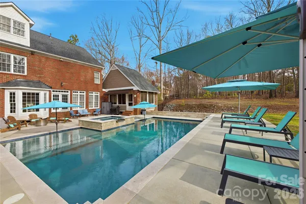 a view of swimming pool with outdoor seating