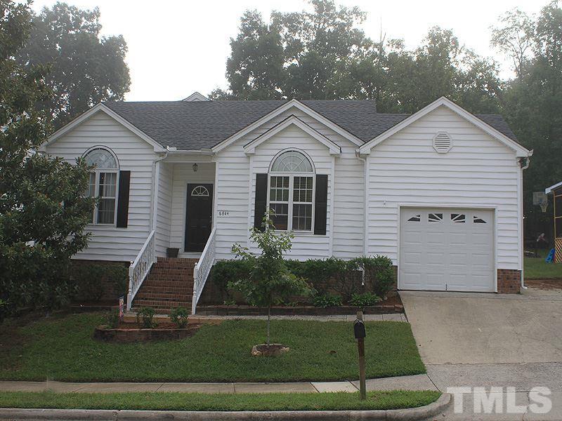 6844 Coventry Ridge Road Raleigh, NC 27616 - Photo 1 of 13 a front view of a house with a yard