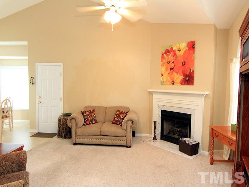 6844 Coventry Ridge Road Raleigh, NC 27616 - Photo 2 of 13 a living room with furniture and a fireplace