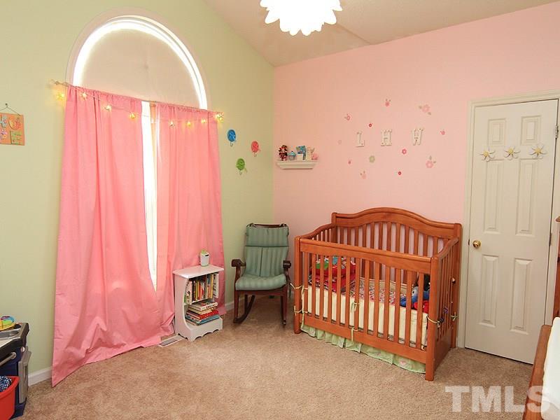 6844 Coventry Ridge Road Raleigh, NC 27616 - Photo 11 of 13 a bedroom with a bed and a window