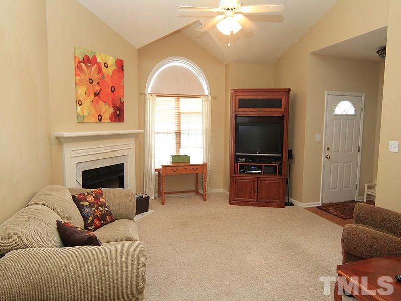 6844 Coventry Ridge Road Raleigh, NC 27616 - Photo 3 of 13 a living room with furniture and a flat screen tv