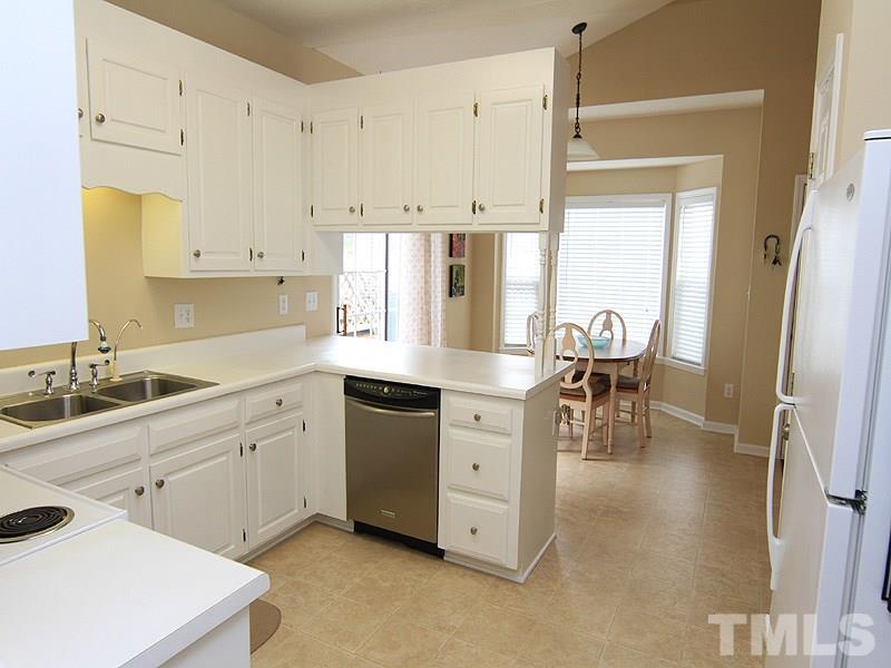 6844 Coventry Ridge Road Raleigh, NC 27616 - Photo 5 of 13 a kitchen with a sink appliances and cabinets
