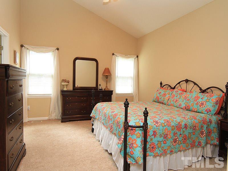 6844 Coventry Ridge Road Raleigh, NC 27616 - Photo 7 of 13 a bedroom with a bed and a dresser