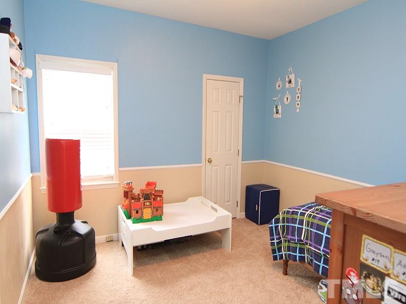 6844 Coventry Ridge Road Raleigh, NC 27616 - Photo 9 of 13 a bedroom with furniture and a window
