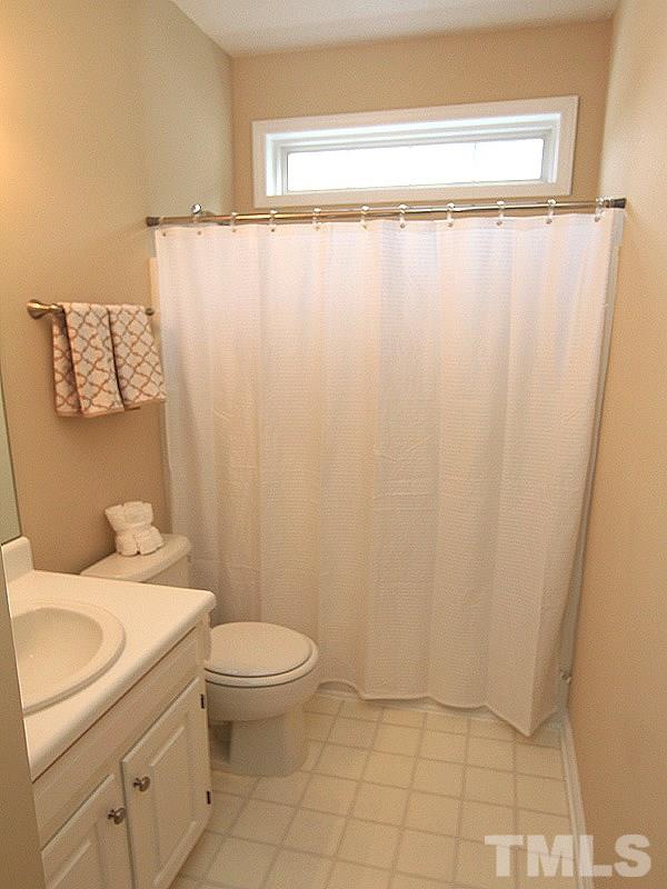 6844 Coventry Ridge Road Raleigh, NC 27616 - Photo 10 of 13 a bathroom with a granite countertop sink toilet and a mirror