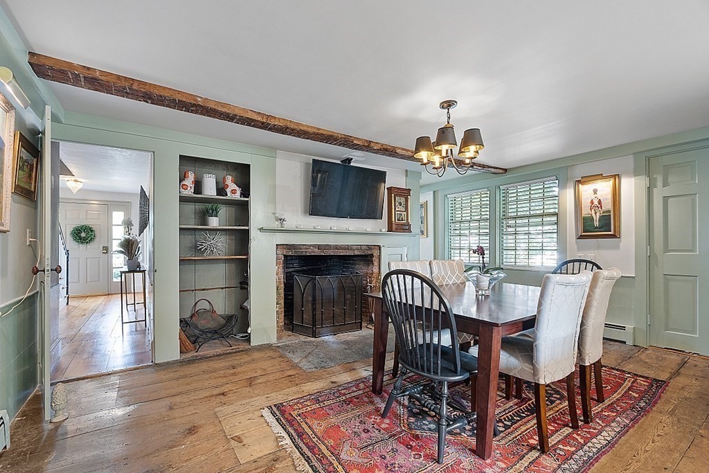 228 Main Street Groton, MA 01450 - Photo 11 of 35 a view of a a dining room with furniture window and wooden floor