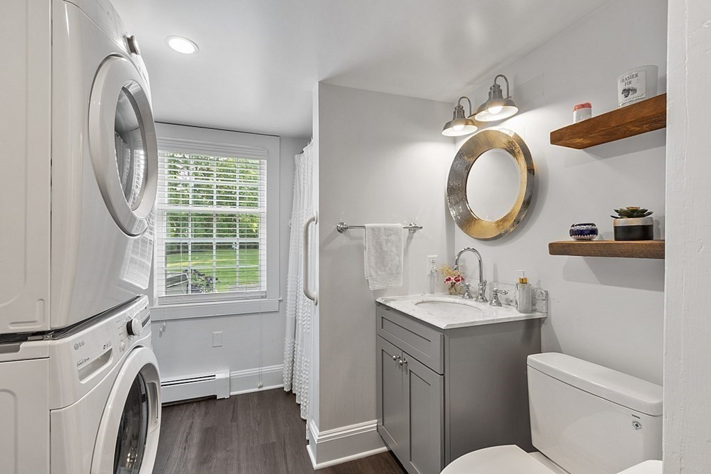 228 Main Street Groton, MA 01450 - Photo 13 of 35 a bathroom with a toilet sink and mirror