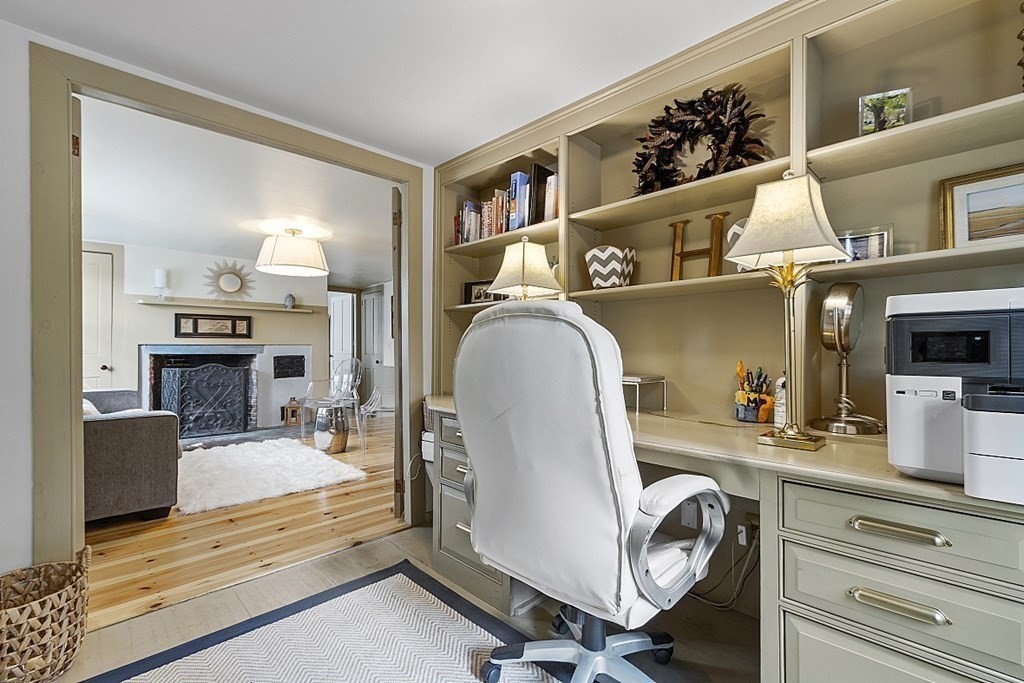 228 Main Street Groton, MA 01450 - Photo 17 of 35 a bedroom with furniture and a fireplace