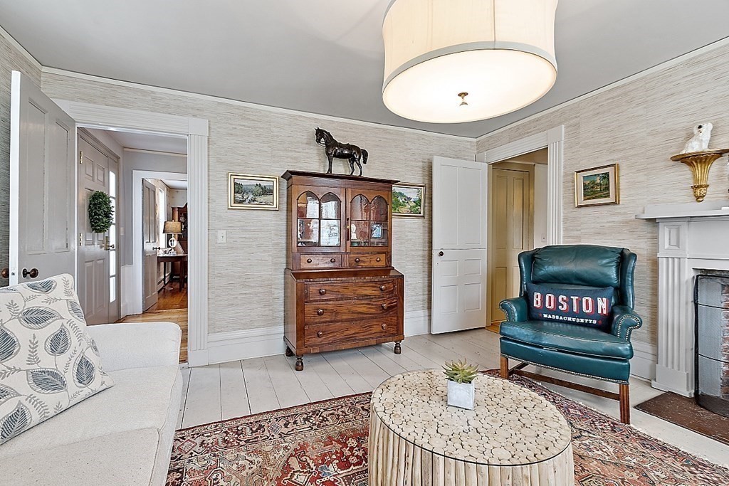 228 Main Street Groton, MA 01450 - Photo 19 of 35 a living room with furniture and a fireplace