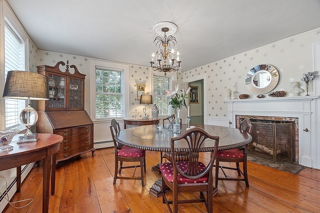 228 Main Street Groton, MA 01450 - Photo 23 of 35 a view of a dining room with furniture window and wooden floor