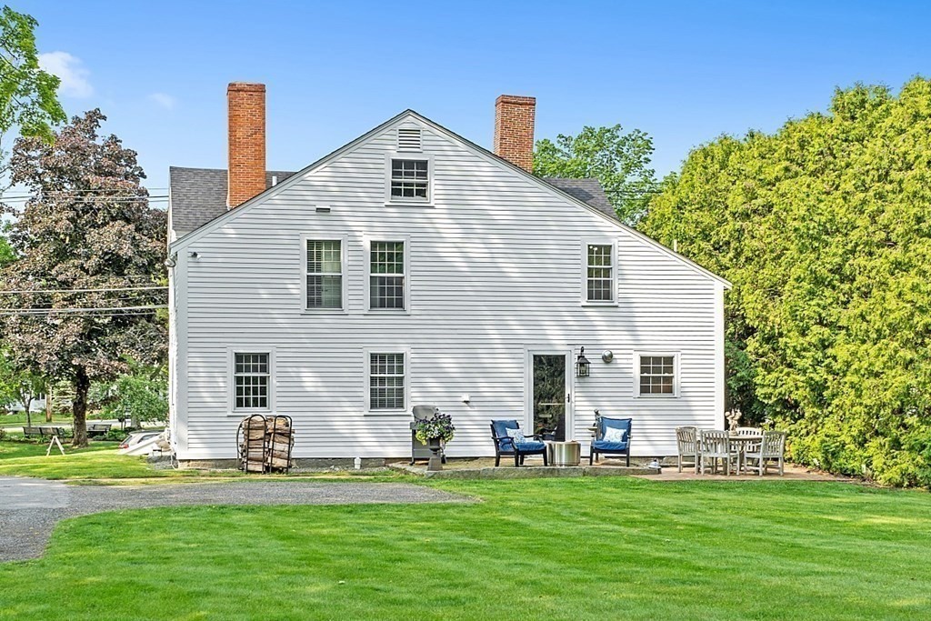 228 Main Street Groton, MA 01450 - Photo 32 of 35 a front view of a house with a yard
