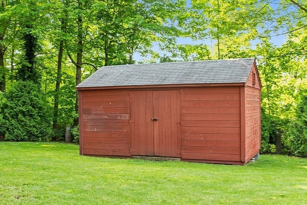 228 Main Street Groton, MA 01450 - Photo 35 of 35 a view of backyard with potted plants and large tree
