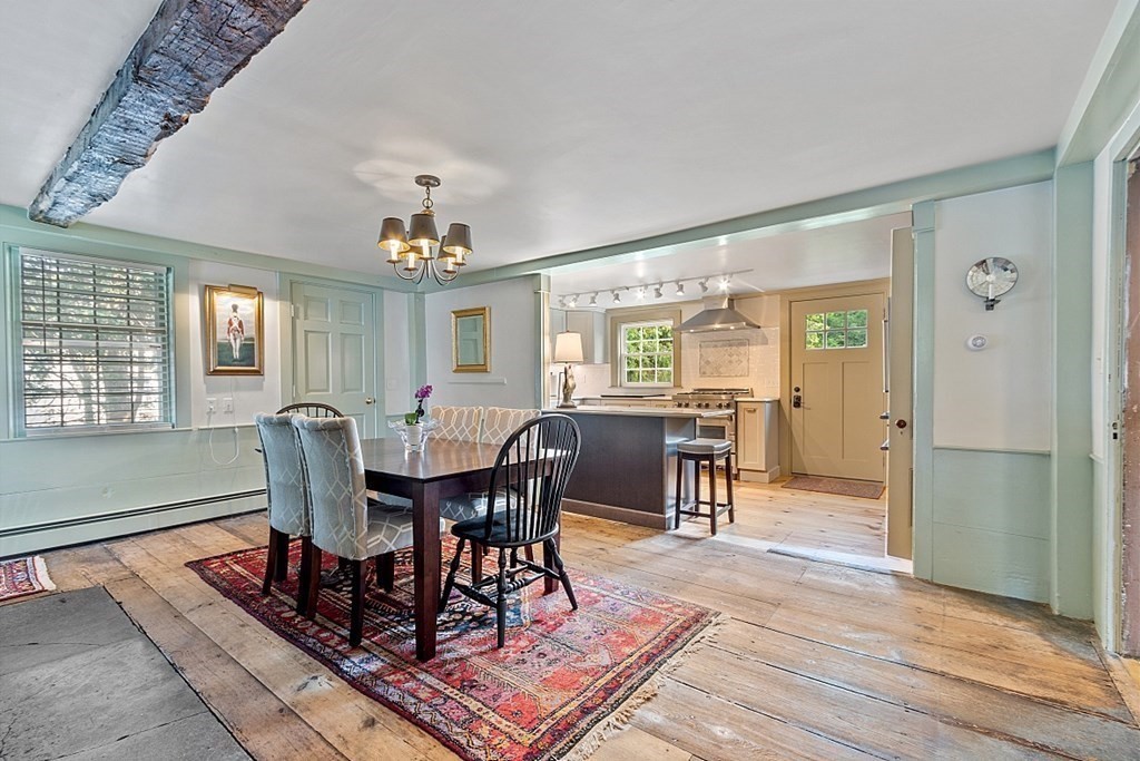 228 Main Street Groton, MA 01450 - Photo 10 of 35 a view of a a dining room with furniture window and wooden floor