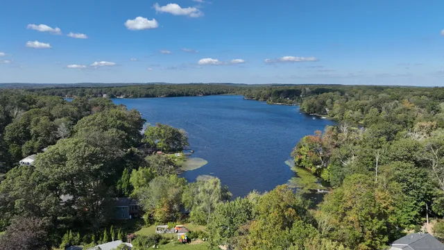 an aerial view of a houses with a yard