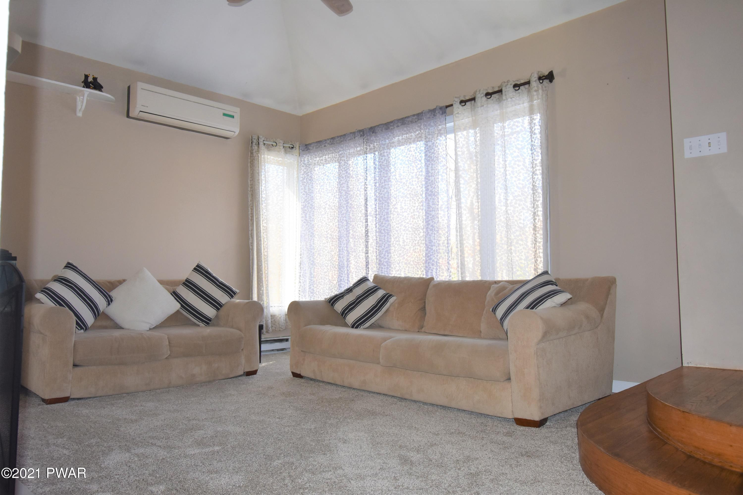244 Fox Road Dingmans Ferry, PA 18328 - Photo 6 of 31 a living room with furniture and a couch