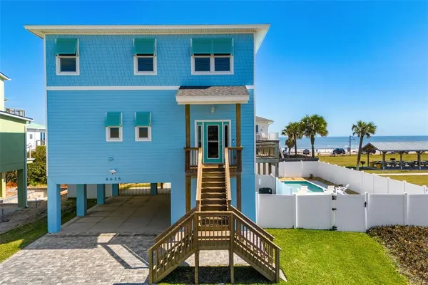 a view of a house with a swimming pool