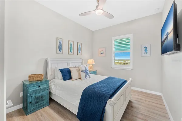 a bedroom with bed and window