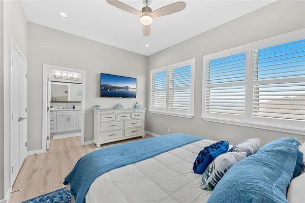 a bedroom with a bed and a couch