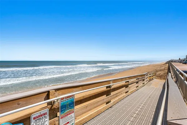 an aerial view of residential building and lake