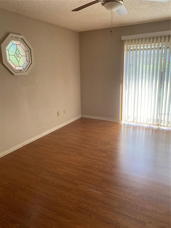 656 Boniview Lane Altamonte Springs, FL 32714 - Photo 11 of 17 an empty room with wooden floor and windows